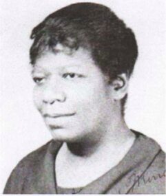Black and white portrait of a woman with short hair.
