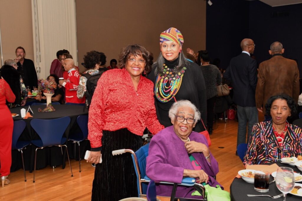 Three generations of women gathered at a social event.