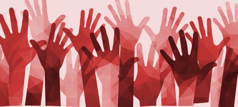 Multiple red and pink translucent hands raised against a light background.