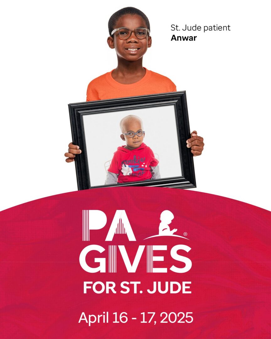 A boy holding a framed photo of a younger child, promoting St. Jude's charity.