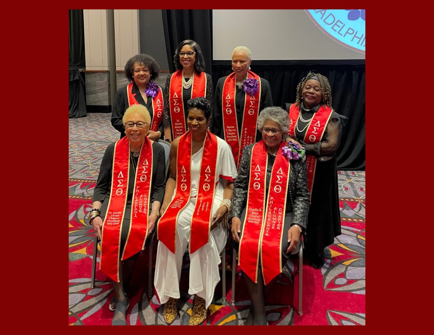Women wearing red Delta Sigma Theta stoles