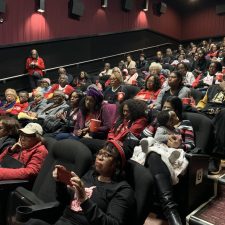 Audience enjoying a movie screening in a theater.